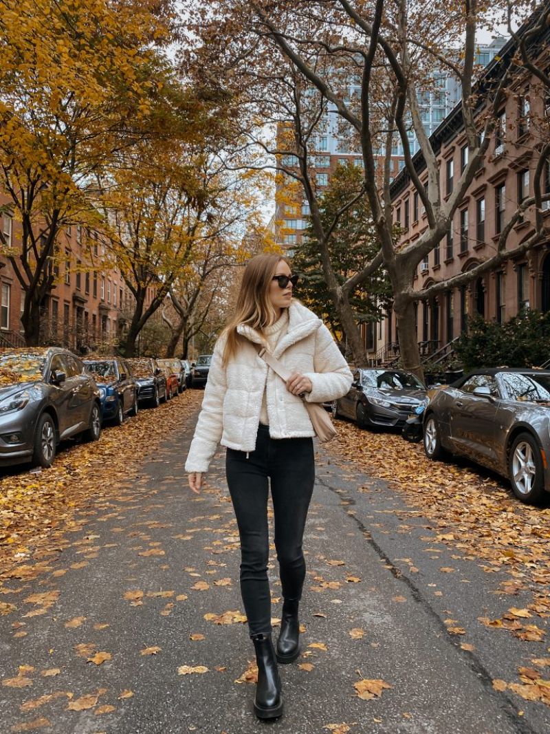 black jeans black platform boots white coat