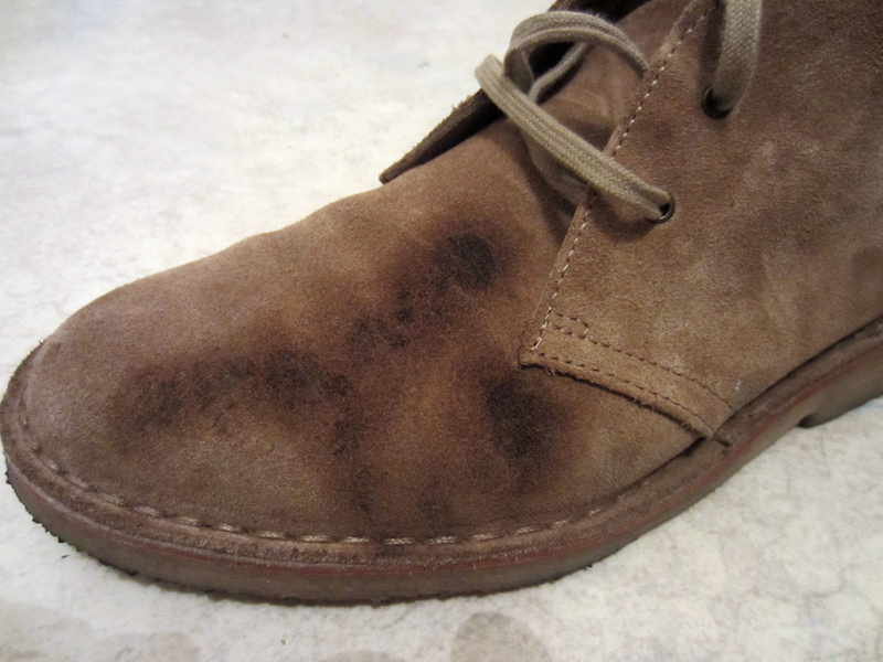 dirty suede boots with water damage and darker spots