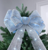 diy christmas tree topper big bow in sparkly baby blue on top of tree