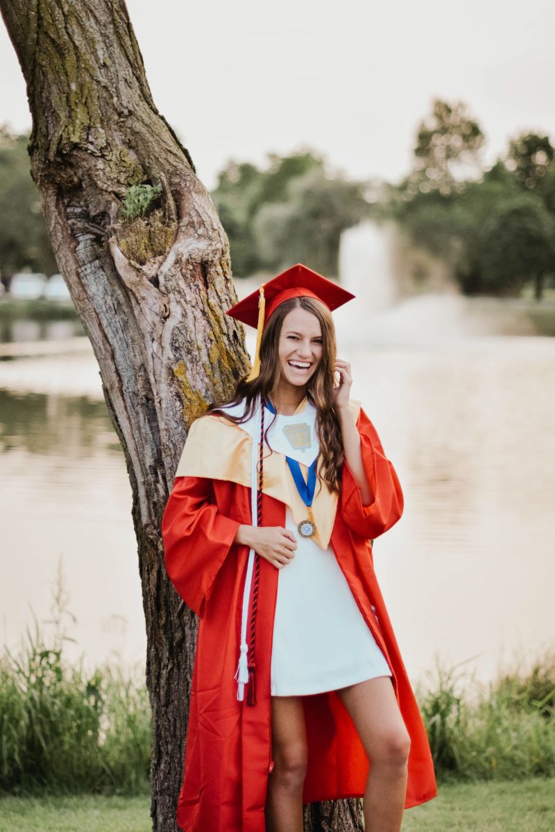 girl wearing white dress high school graduation outfit ideas