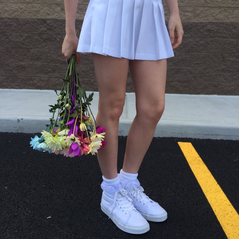 girl with white vans high tops and white tennis skirt