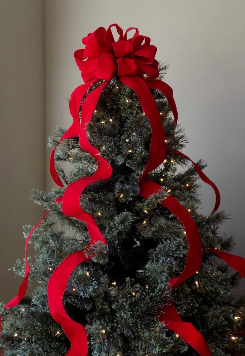 how to tie a christmas bow for your tree using three ribbons