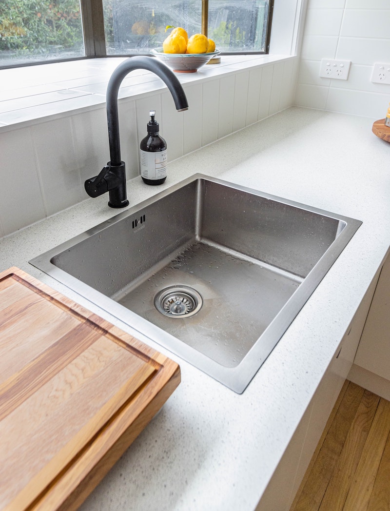 keeping your kitchen sink fresh and clean using baking soda as a cleaner