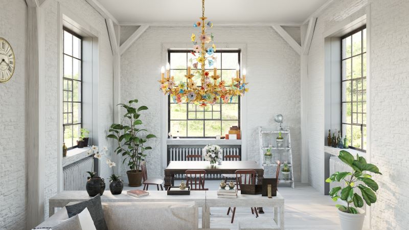 living room with tall windows entryway light fixtures colorful glass chandelier