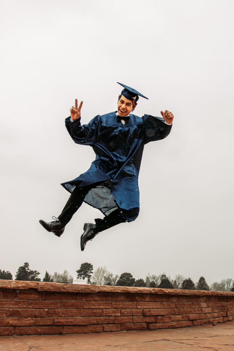 man jumping in the air plus size graduation dresses