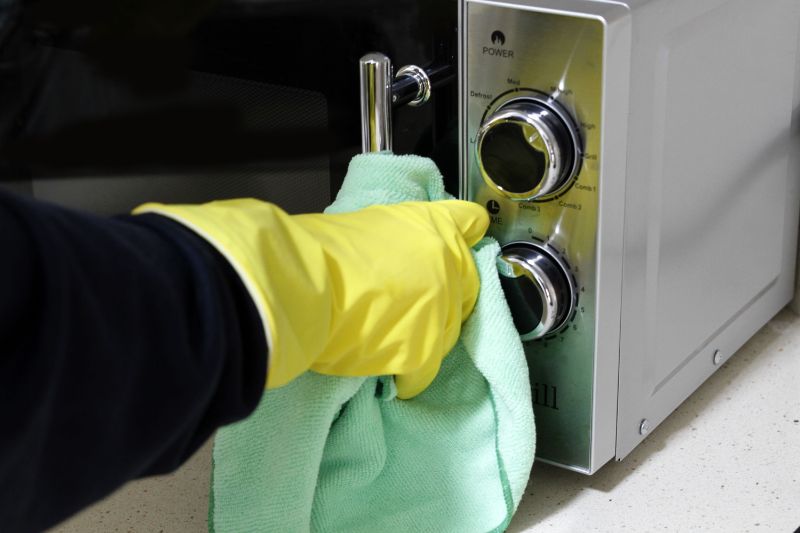 microwave cleaning hack wiping the handle