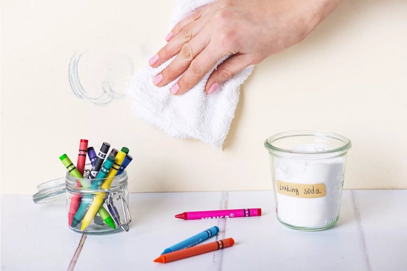 removing colorful crayon stains and drawings from white walls with baking soda