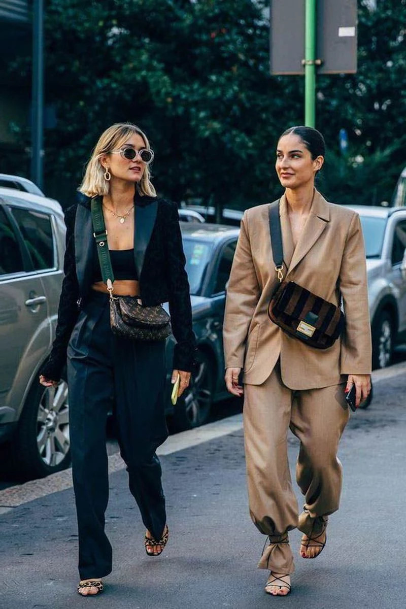 two girls wearing suits in 60 degree weather