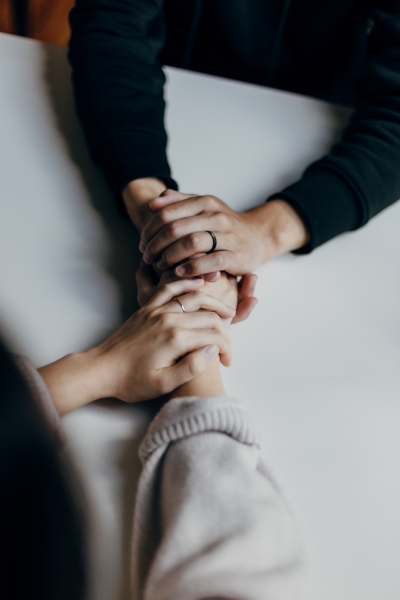 two people holding hands mental health