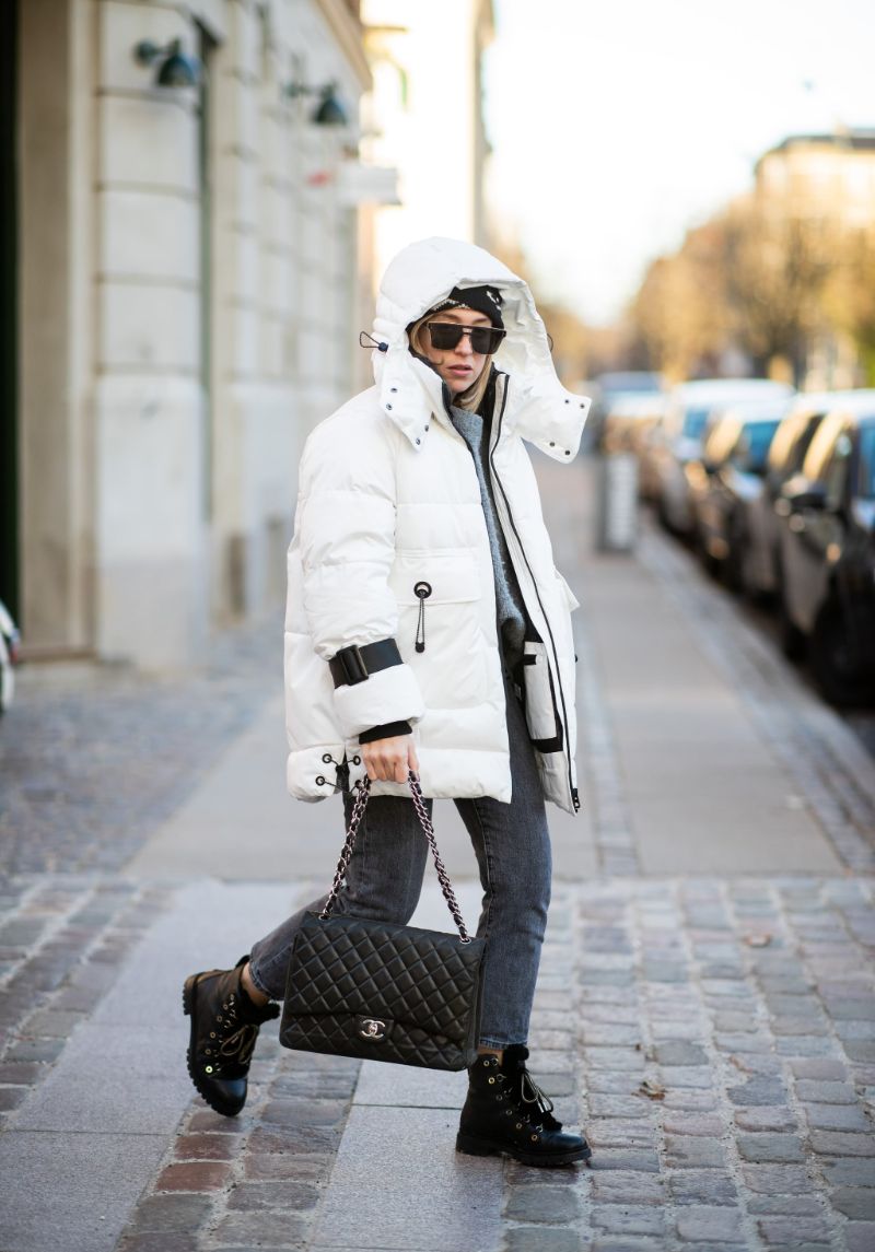 white puffer jacket black lace up boots jeans