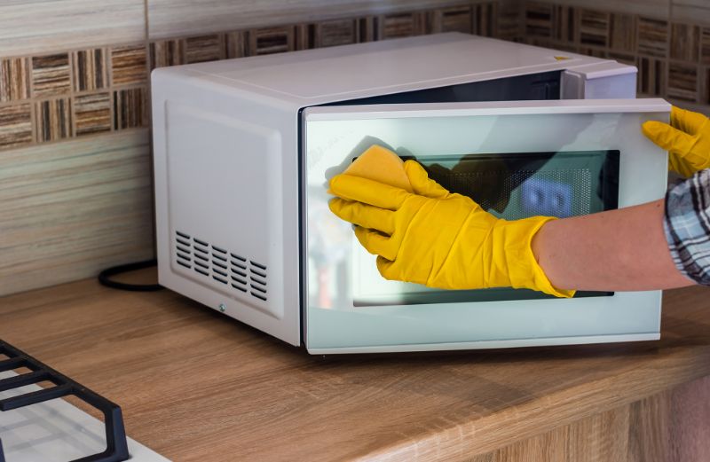 wiping the window of microwave cleaning hack