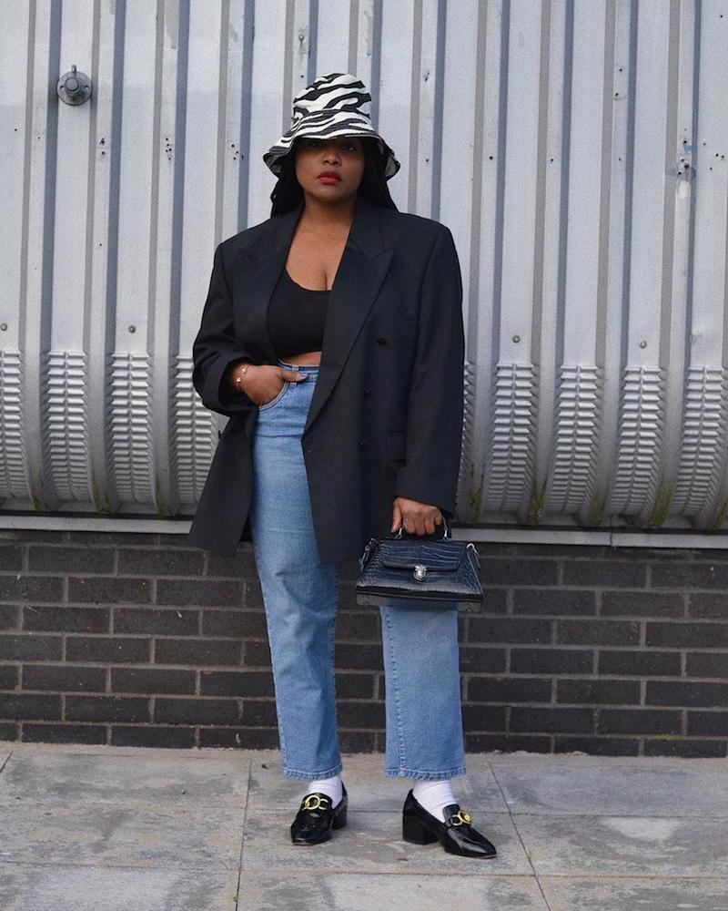 woman black blazer and zebra hat