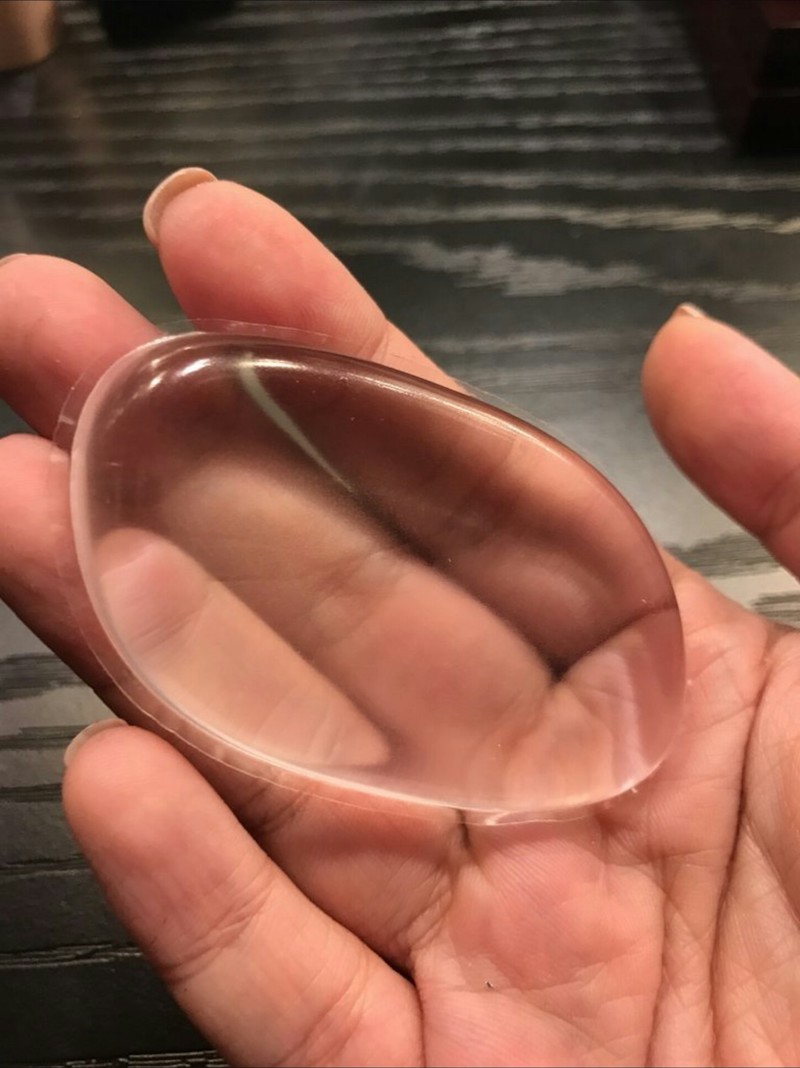 woman holding transparent silicone beauty blender