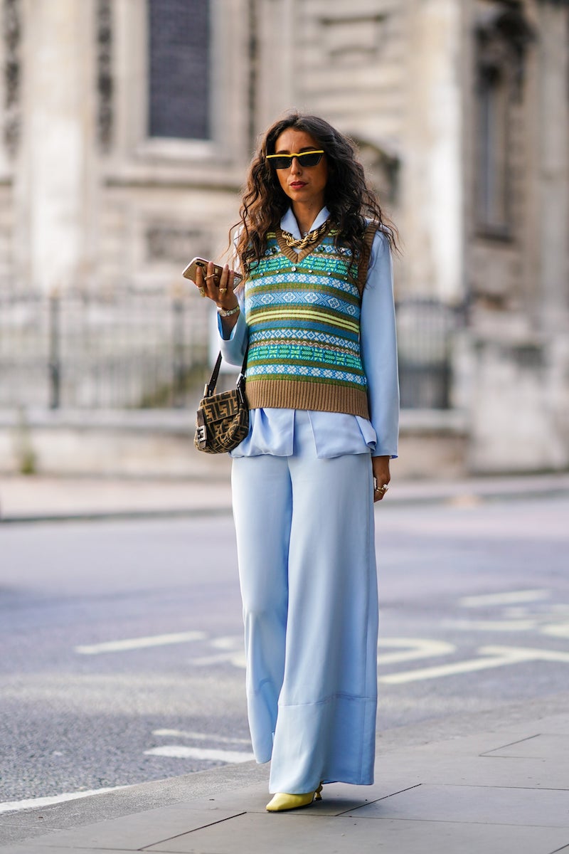 woman rocking the knitted vest trend street style