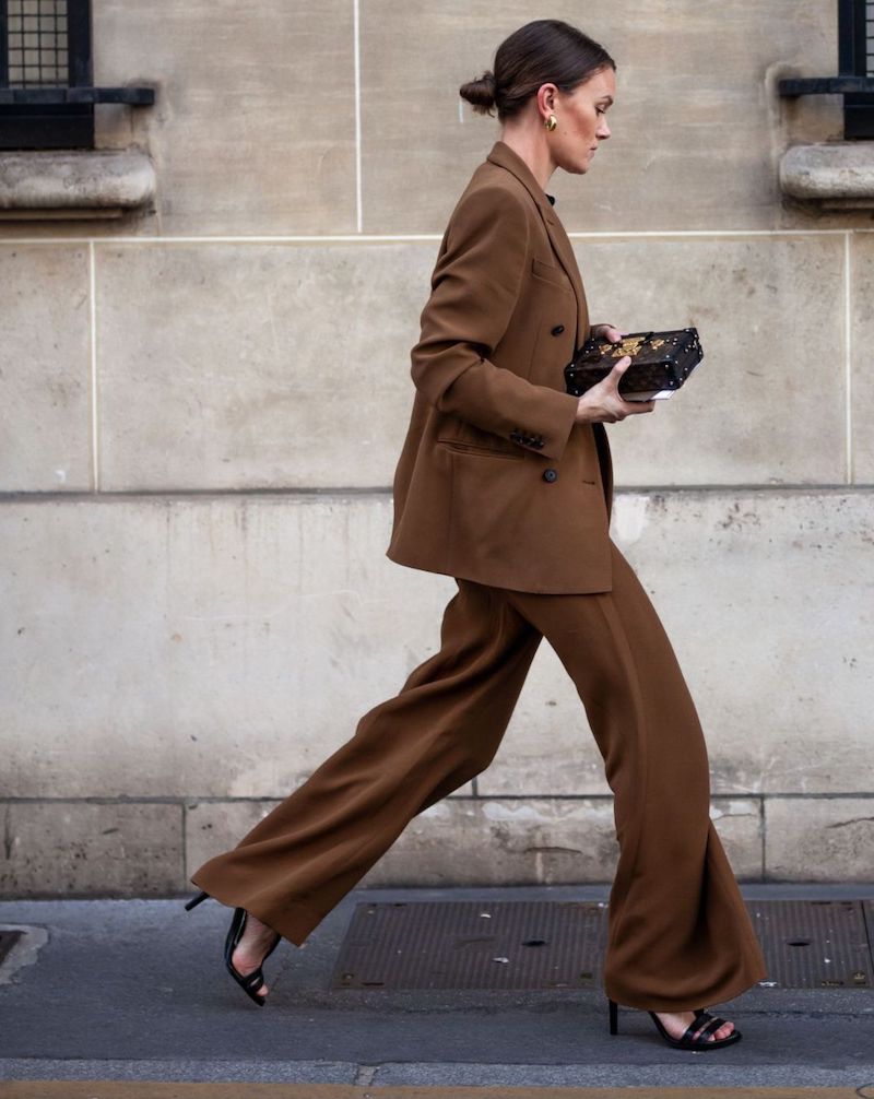 woman styling a matching suit for 60 degree weather