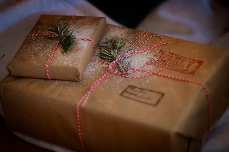 aesthetic packaging for christmas gifts from santas workshop with fake snow decoration