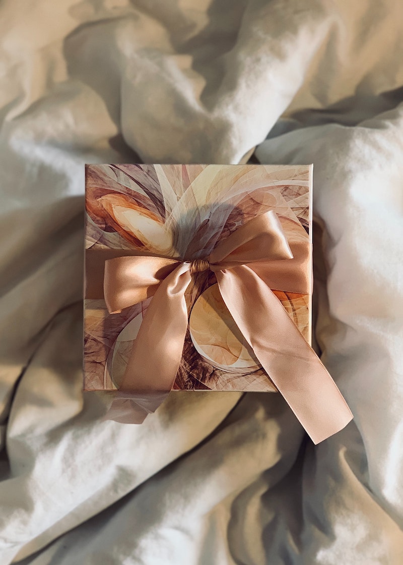 aesthetic packaging for christmas gifts with baby pink satin ribbon