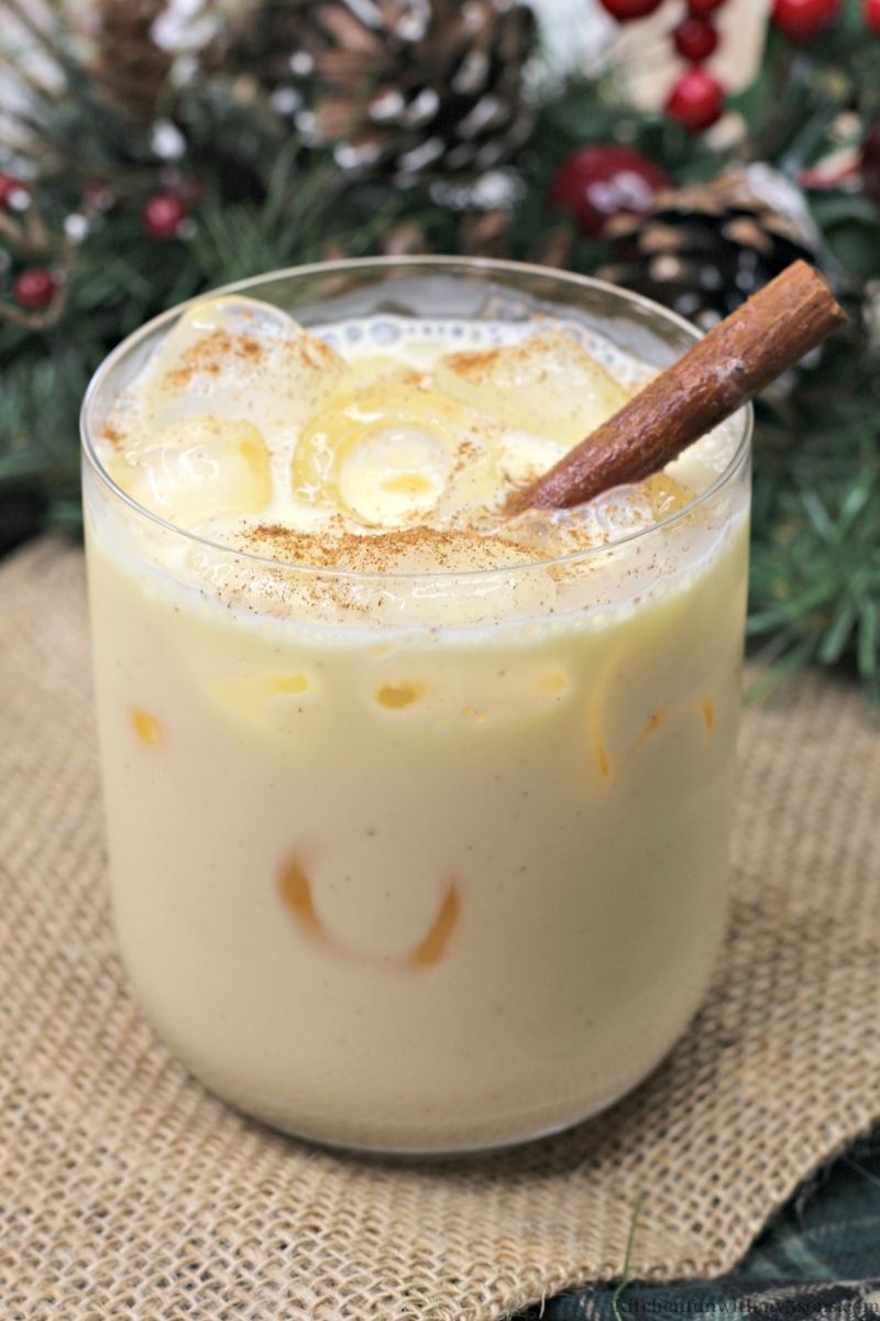 amaretto eggnog cocktail with cinnamon stick