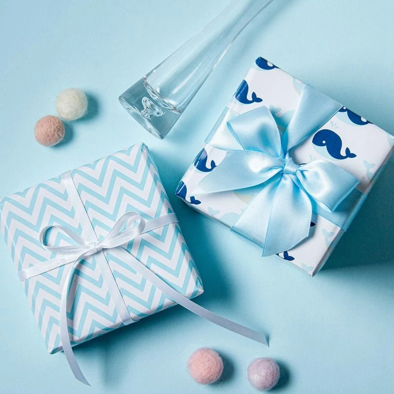 blue wrapping paper baby shower gift bags ribbons