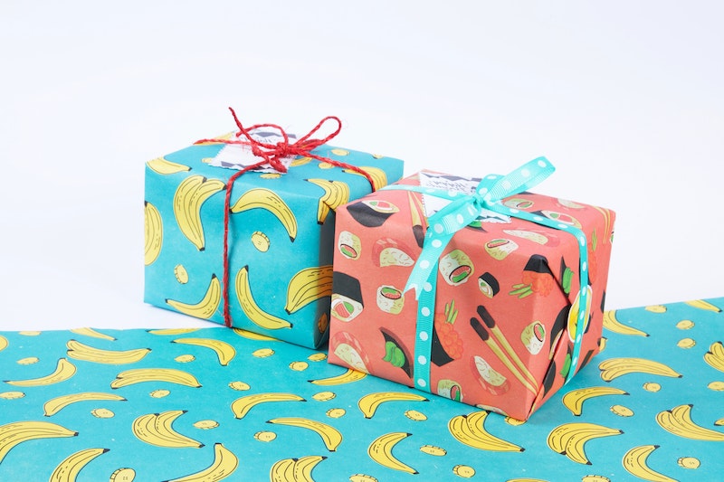 colorful crazy christmas wrapping paper with bananas and sushi illustrations