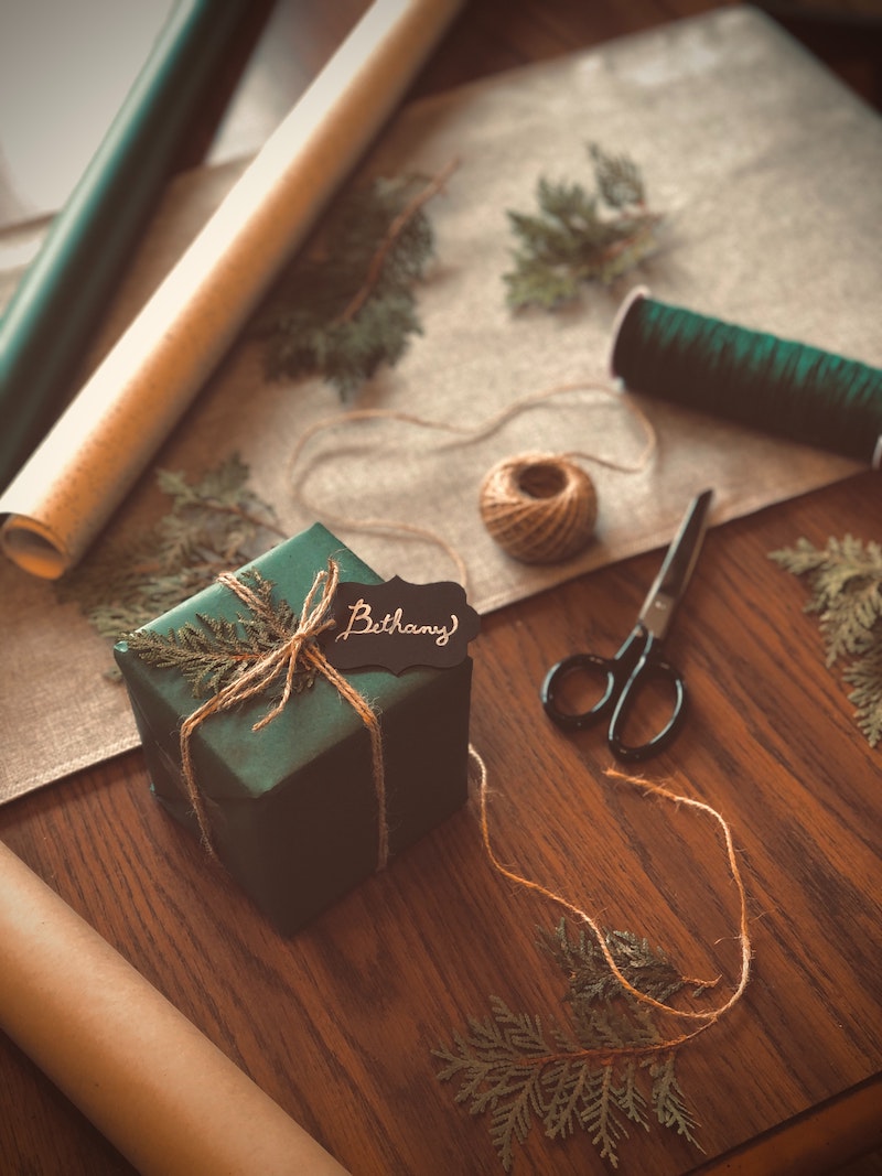 creative packaging with dried tree branches and christmas card