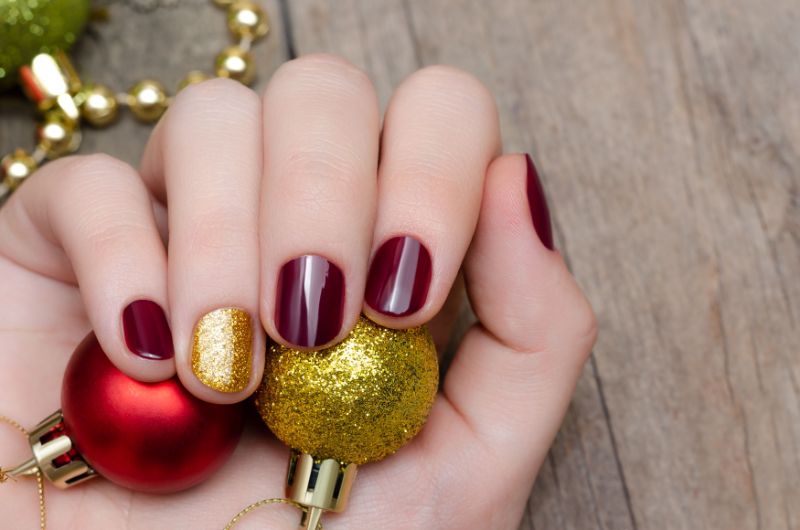 dark red christmas nails 2021 gold glitter