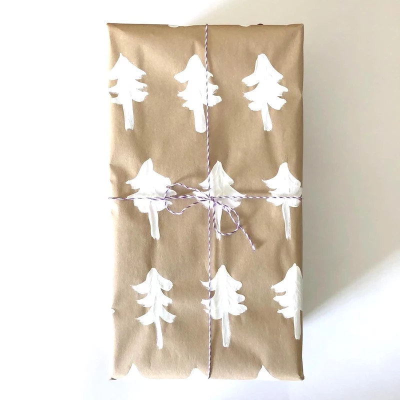 diy packaging ideas for christmas gifts with handrawn elements and yarn ribbon