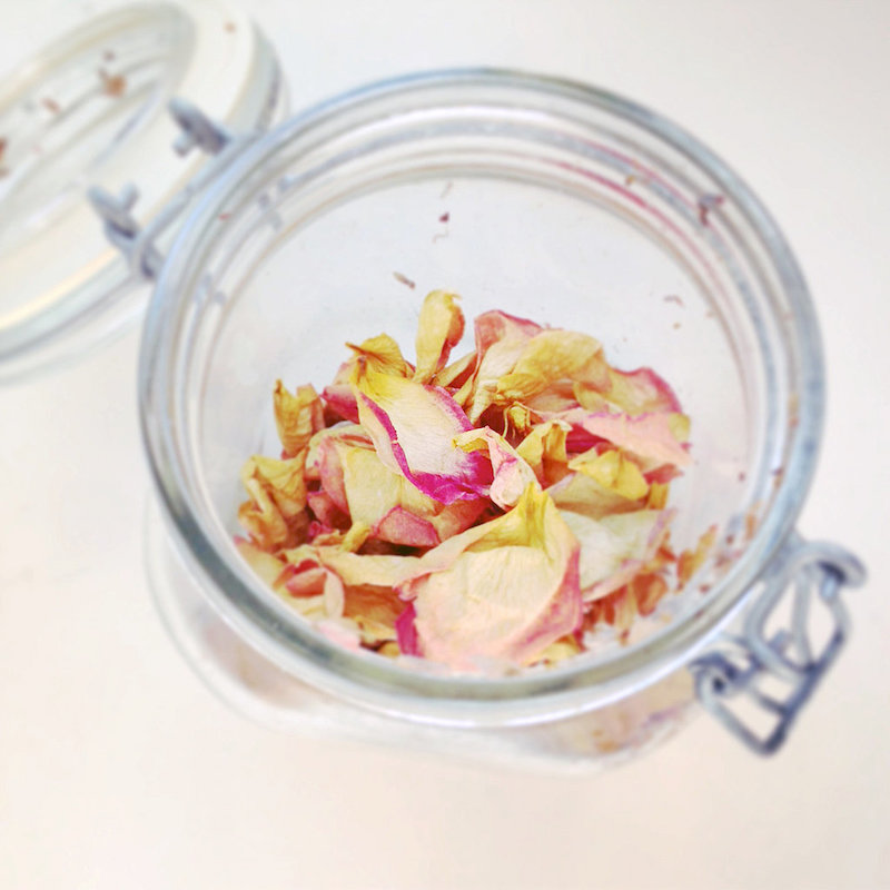 dry pink rose petals in a glass jar potpourri diy for a gift