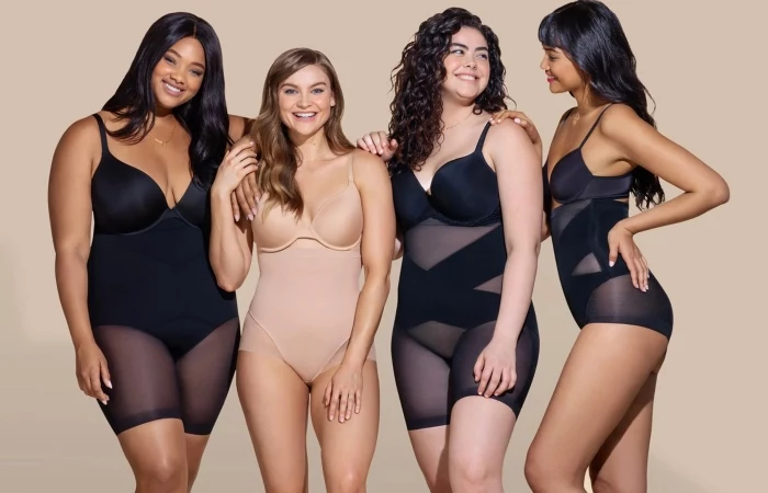 four women wearing different shapewear black nude