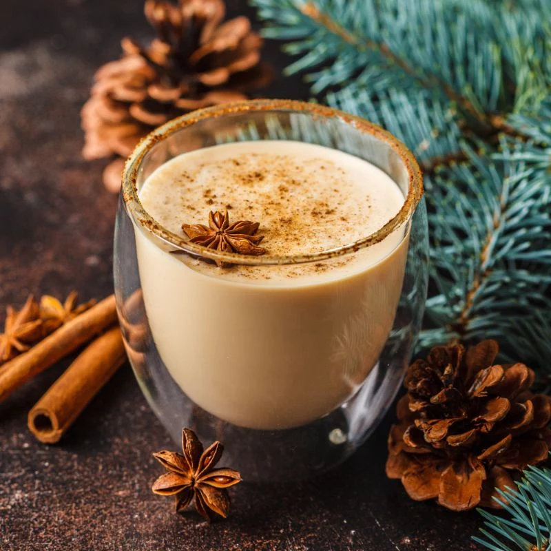 glass of eggnog recipe with cinnamon star anise