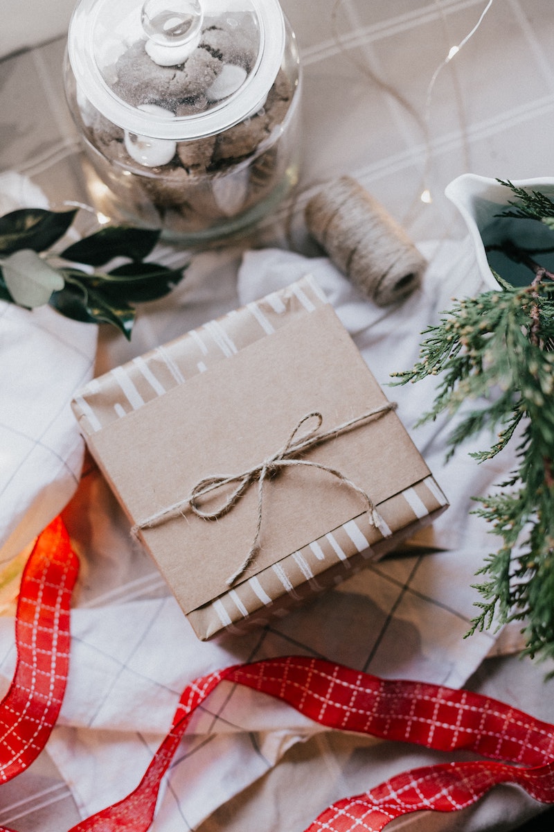 minimalistic aesthetic packaging with brown paper wrapper and yarn ribbon to match