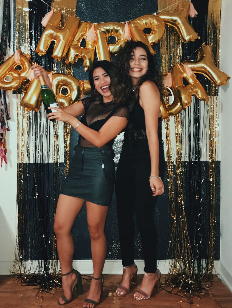 two girls dressed in black 21st birthday outfit ideas