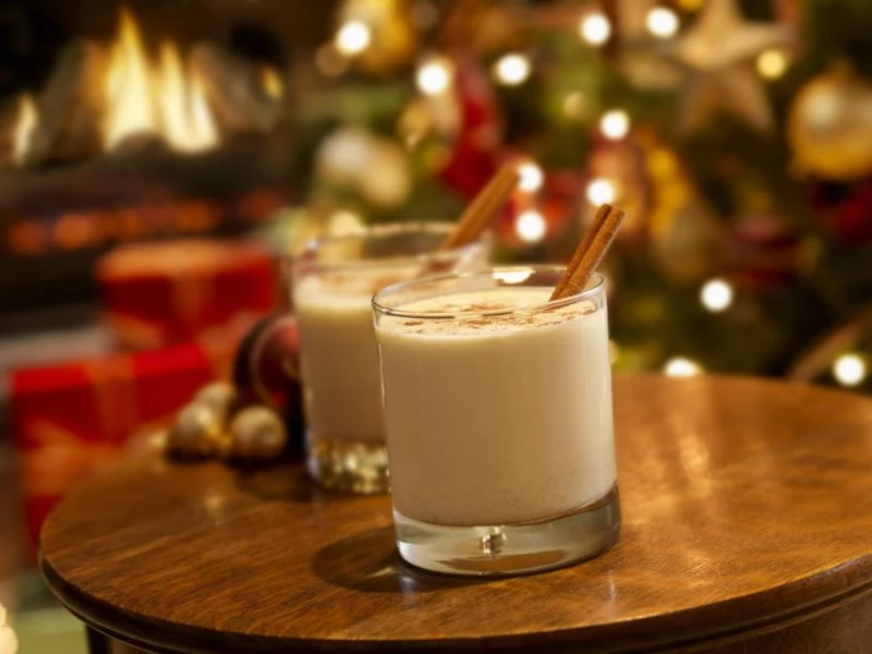 two glasses eggnog ingredients christmas tree