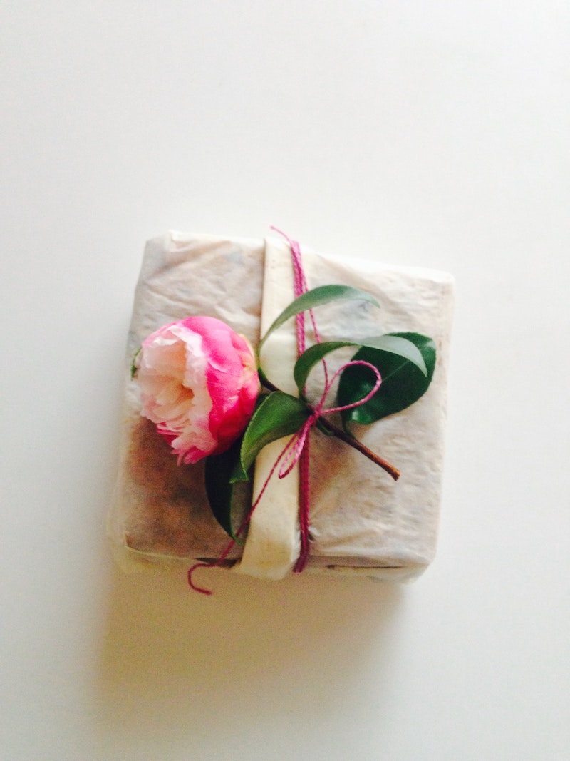 using christmas tissue wrap and pink flower for presents