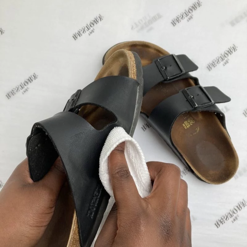 how to clean white birkenstocks black leather sandals being cleaned