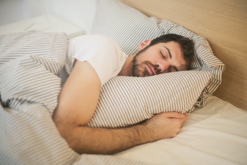 natural decongestant man sleeping while hugginh a pillow