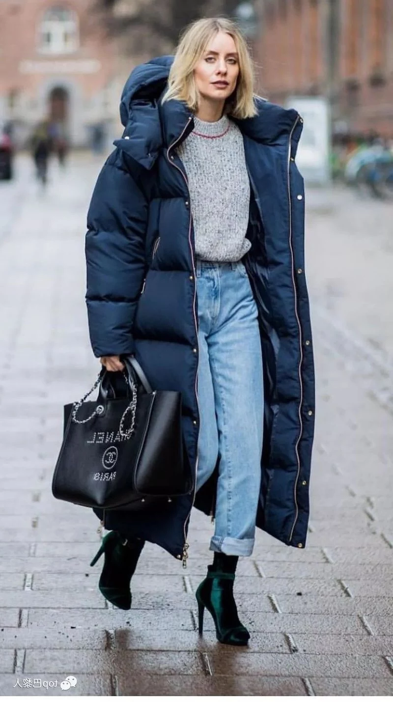 what to wear in new york woman wearing long puffer jacket