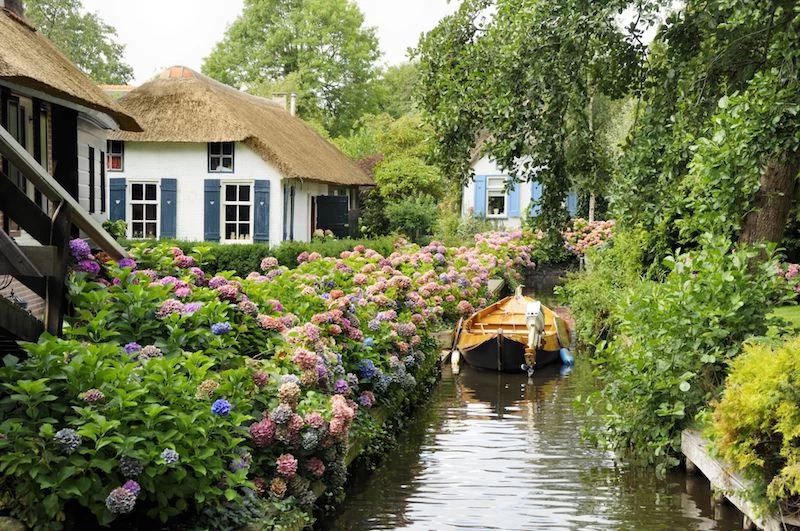 cottagecore aesthetic outfits historic dutch houses with river boat and many