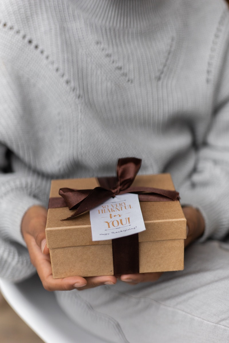 unique home decor woman holding gift