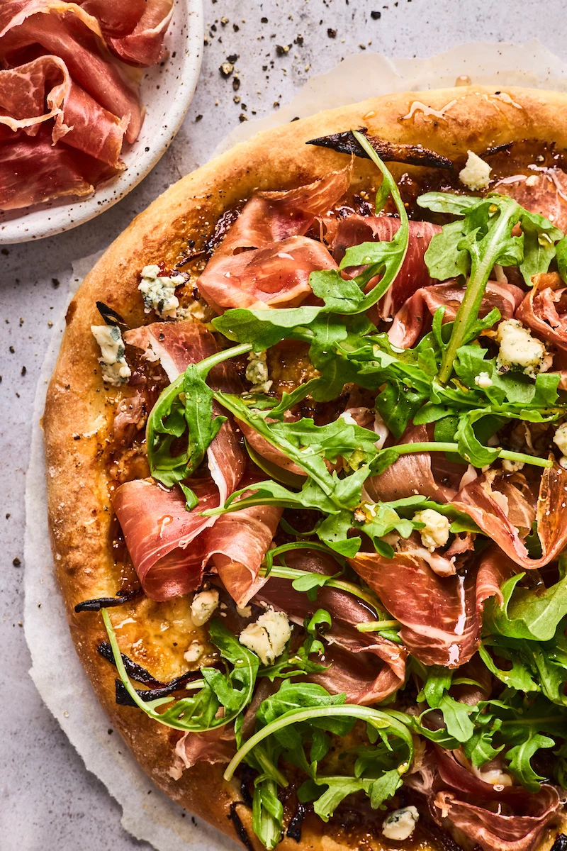 fig prosciutto gorgonzola and arugula pizza with hot honey dinner date ideas