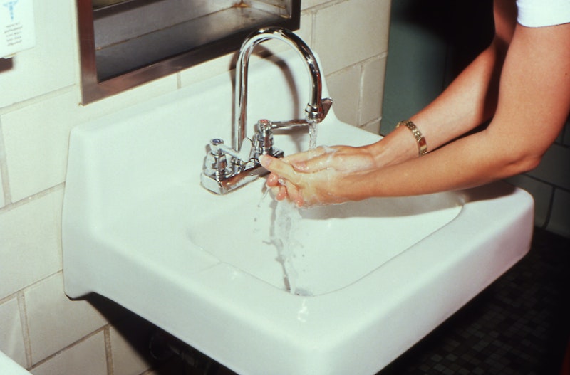 how to snake a drain person washing hands