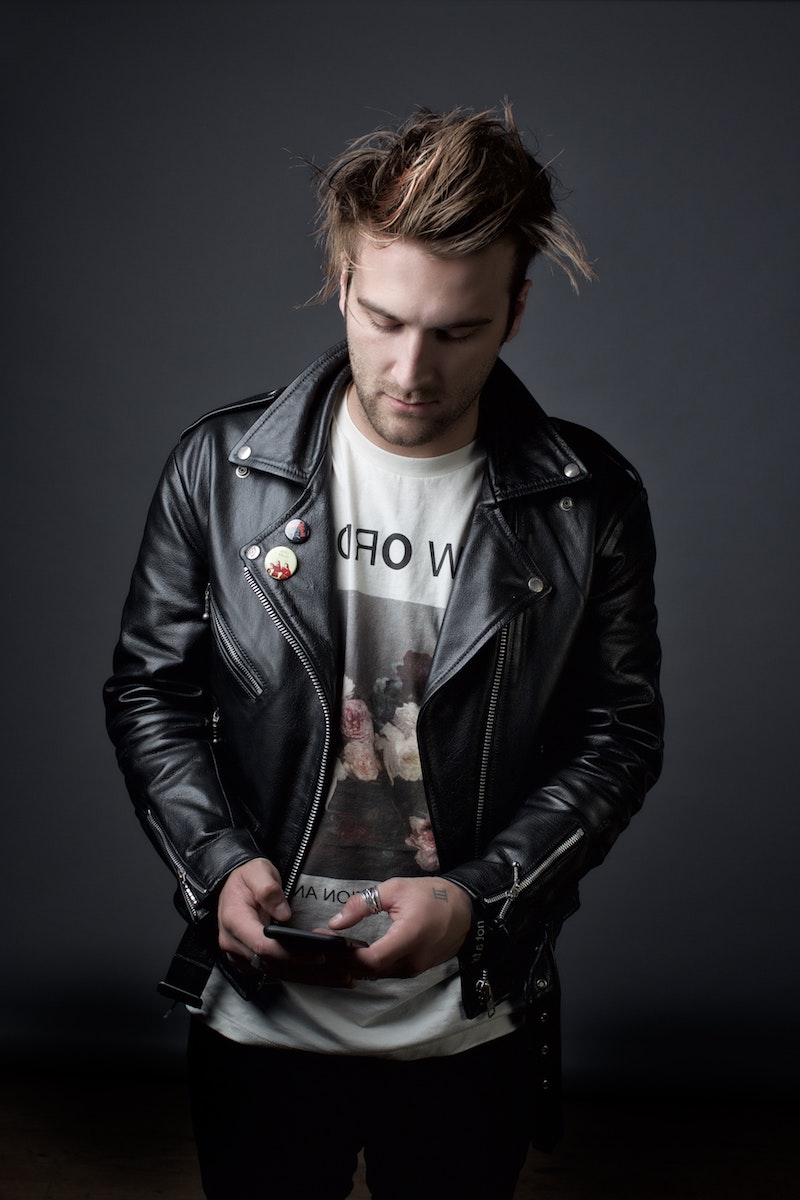 man with t shirt and leather jacket