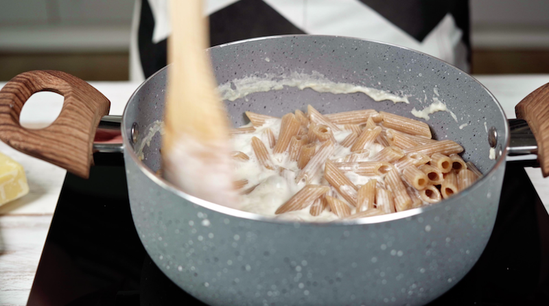 stirring the pasta