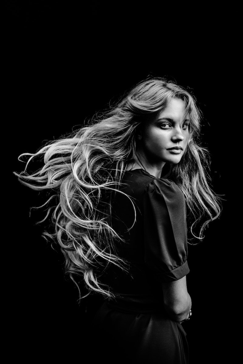 black and white picture of girl with thick hair