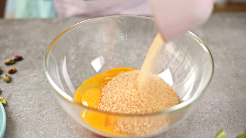brown sugar in a bowl with egg yolks