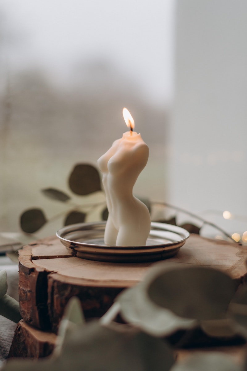 candle shaped in the form of a womans body