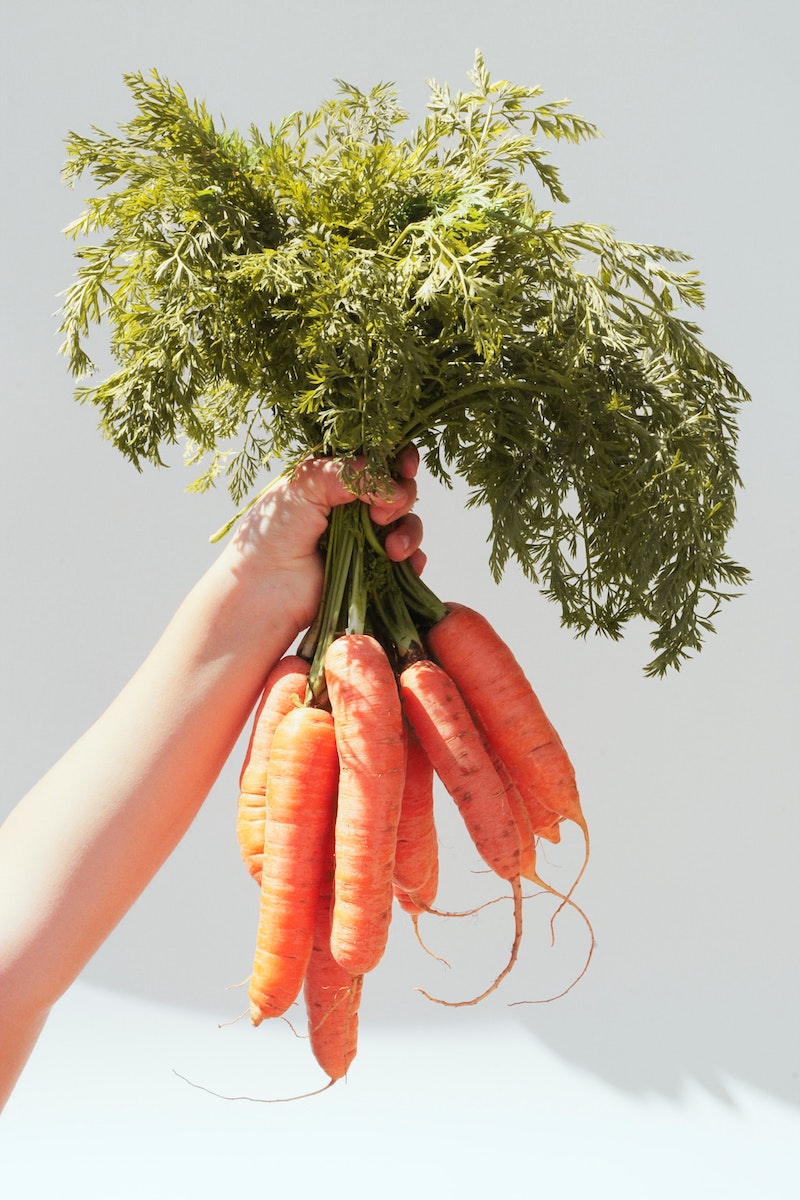 Eat healthy carrots in white font