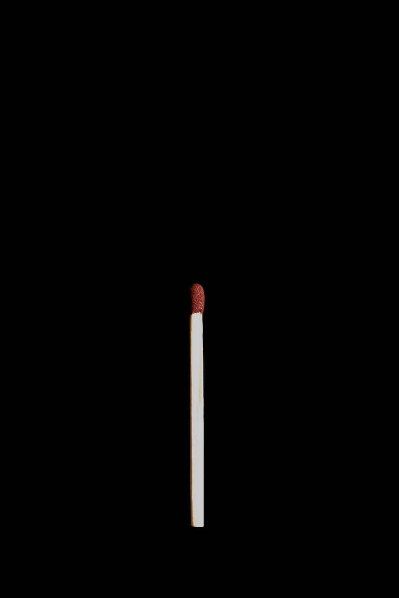 matchstick on black background