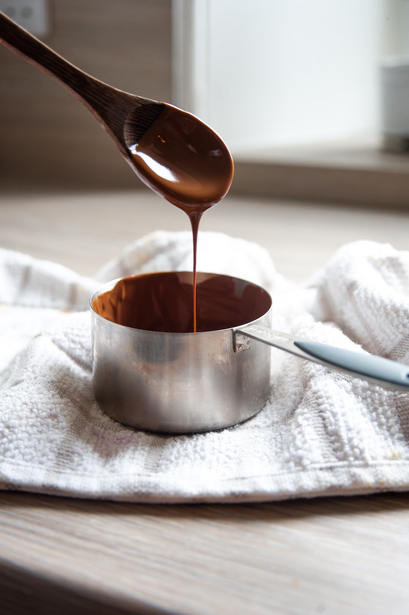 melted chocolate dripping from a spoon