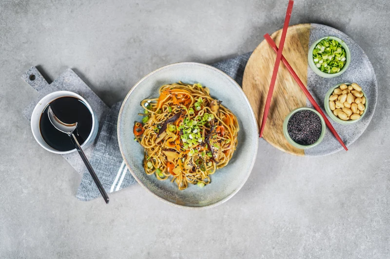 noodles with vegetables and sweet and sour sauce